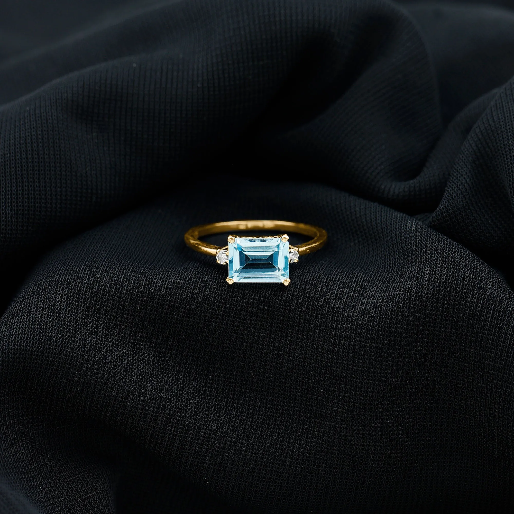 Emerald Cut Sky Blue Topaz East West Engagement Ring with Diamond