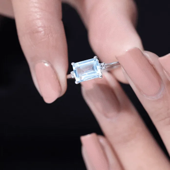 Emerald Cut Sky Blue Topaz East West Engagement Ring with Diamond