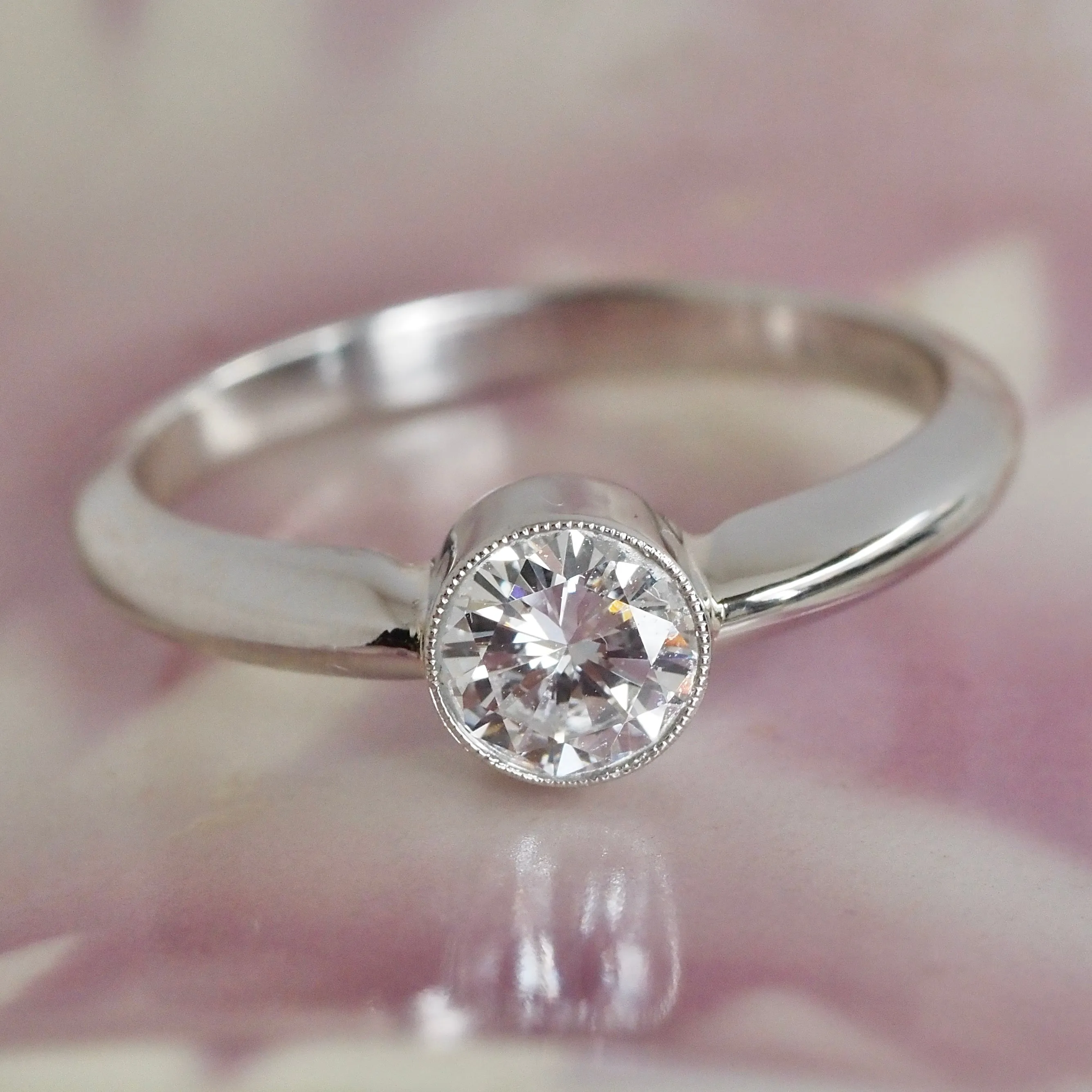 Half Carat Round Brilliant Cut Diamond Solitaire Platinum Bezel Set Engagement Ring