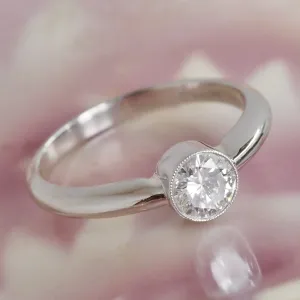 Half Carat Round Brilliant Cut Diamond Solitaire Platinum Bezel Set Engagement Ring