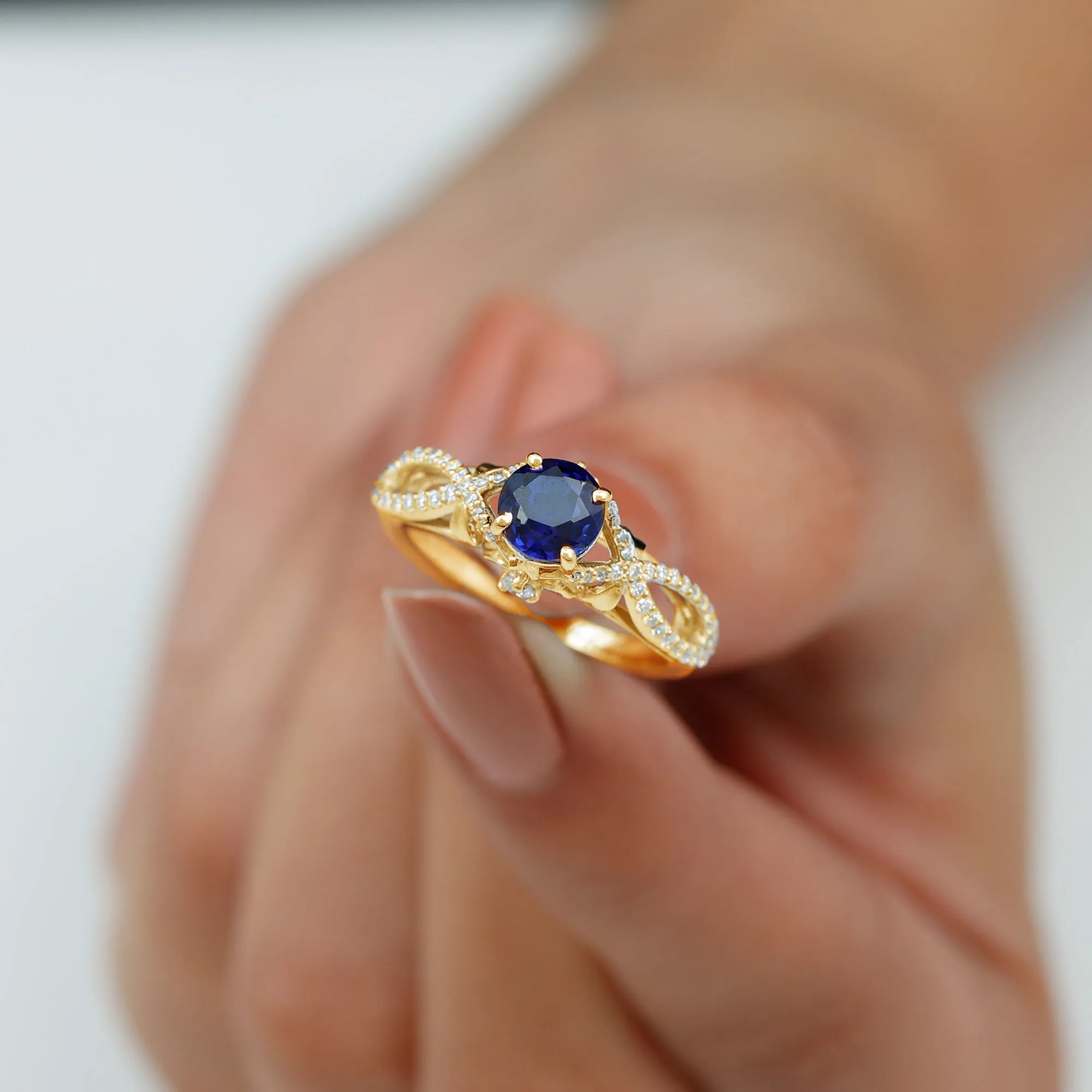Lab Grown Blue Sapphire Crossover Engagement Ring with Diamond