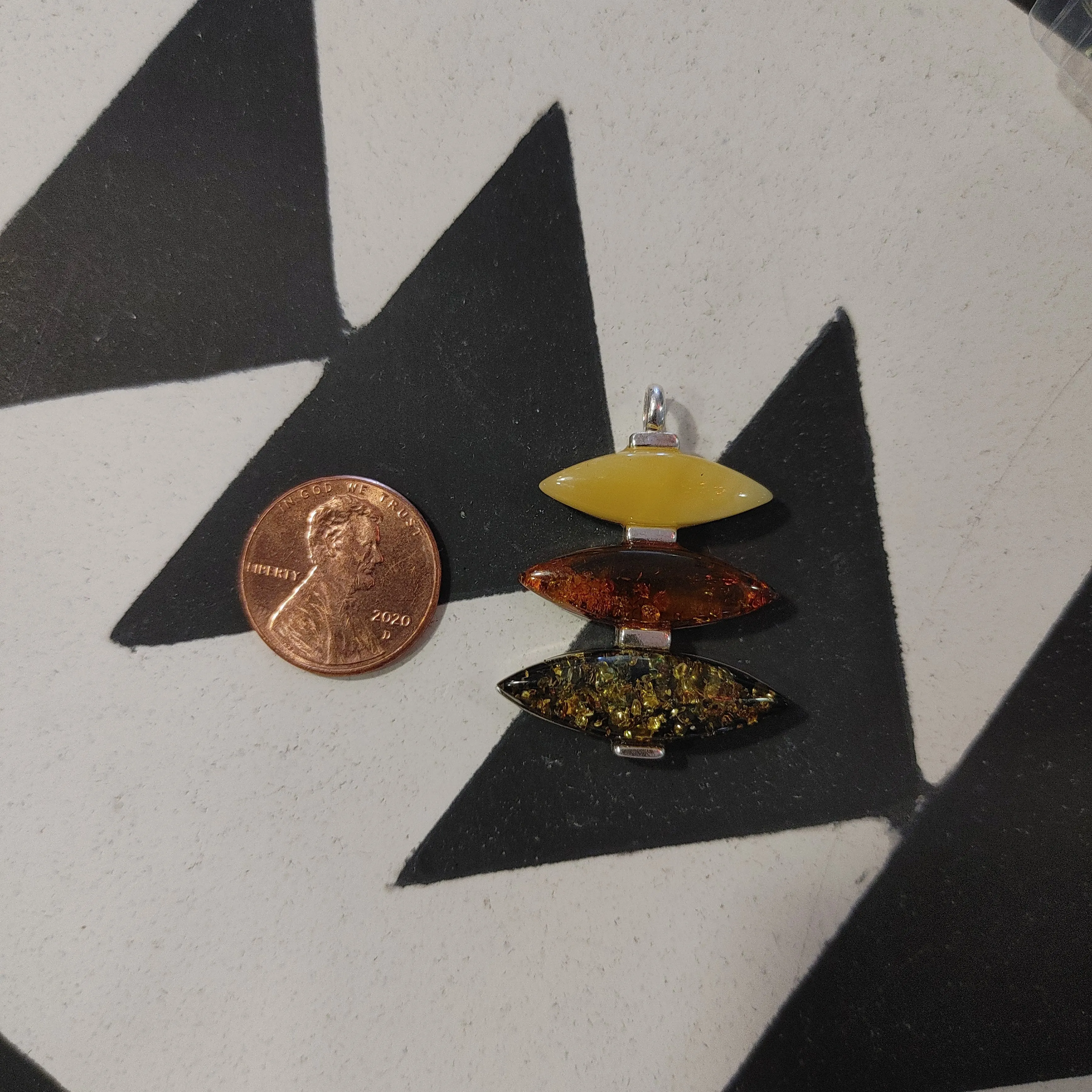 Oval Shaped Three Tiered Amber Pendant